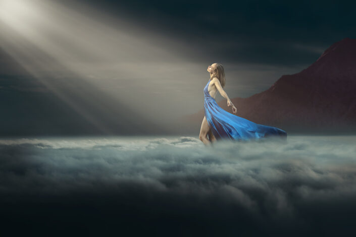 Woman walking in the clouds
