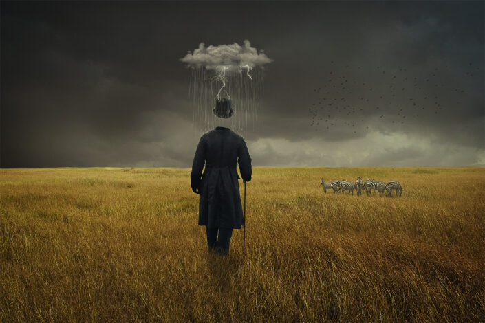 surreal image of headless man walking in field